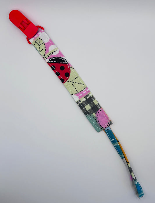 attache-tétine Bubuclip patchwork rose - petit beba